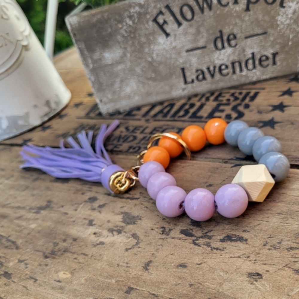Cute keychain, wristlet! Stretch bracelet, wood beads, leather tassle, keyring